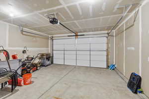 Garage featuring a garage door opener