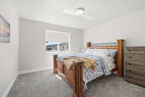 Bedroom featuring carpet flooring and baseboards