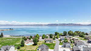Aerial view of residential area featuring a water and mountain view
