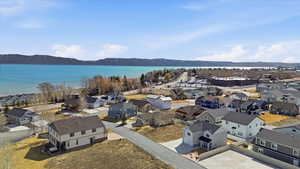 Aerial view of residential area featuring a water and mountain view