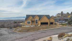 Property under construction featuring covered porch and a mountain view