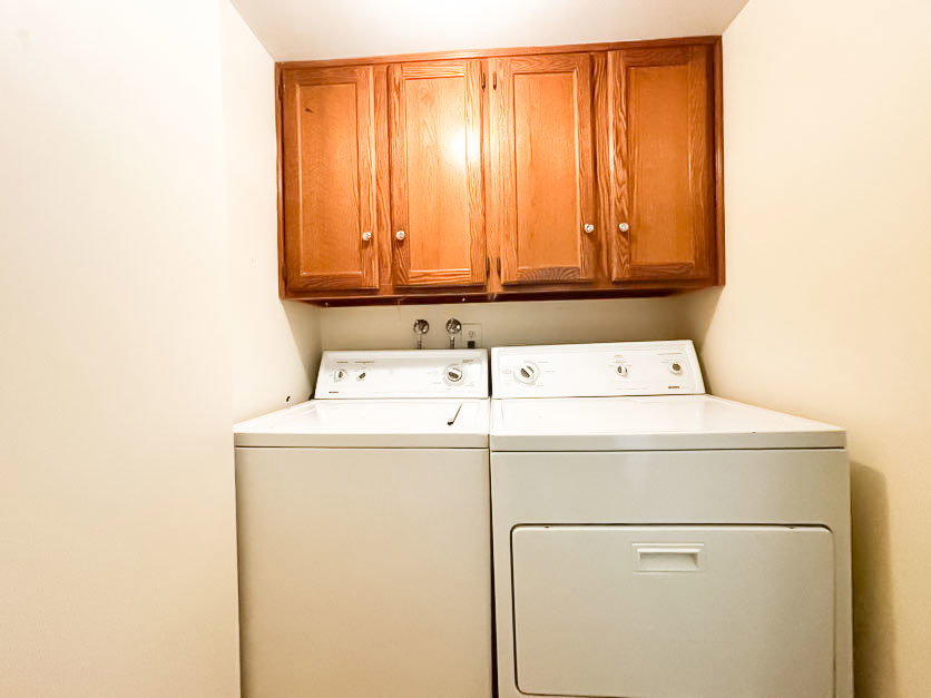 Laundry area with cabinet space and independent washer and dryer