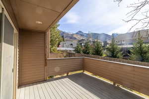 Deck featuring a residential view and a mountain view