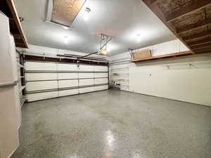 Garage featuring a garage door opener