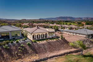 Aerial view from the back of home of residential area featuring mountains