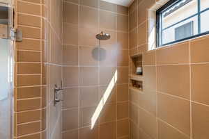 Full bath with a shower stall