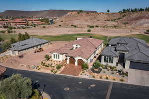 Aerial perspective of suburban area with a local golf course and a mountainous background