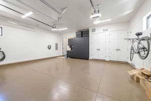 Garage with electric panel and a garage door opener