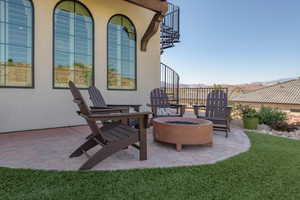 View of patio featuring an outdoor fire pit and a mountain view