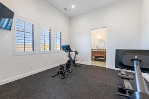 Exercise room with rubber floors and recessed lighting