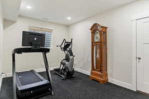 Exercise area featuring baseboards and recessed lighting