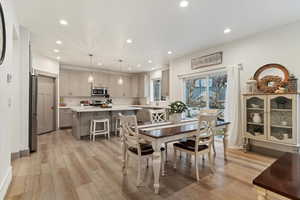 Dining area featuring recessed lighting and light wood finished floors