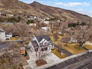 Aerial perspective of suburban area featuring a mountainous background
