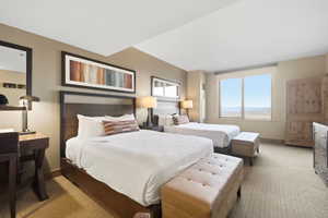 Bedroom featuring light colored carpet and baseboards