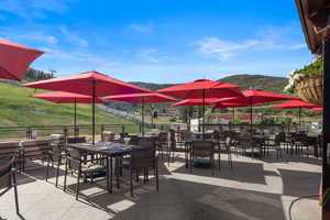 View of patio/terrace with a mountain view and outdoor dining space