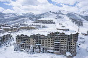 Snowy aerial view featuring a mountain view