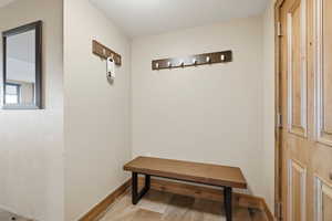 Hallway featuring baseboards