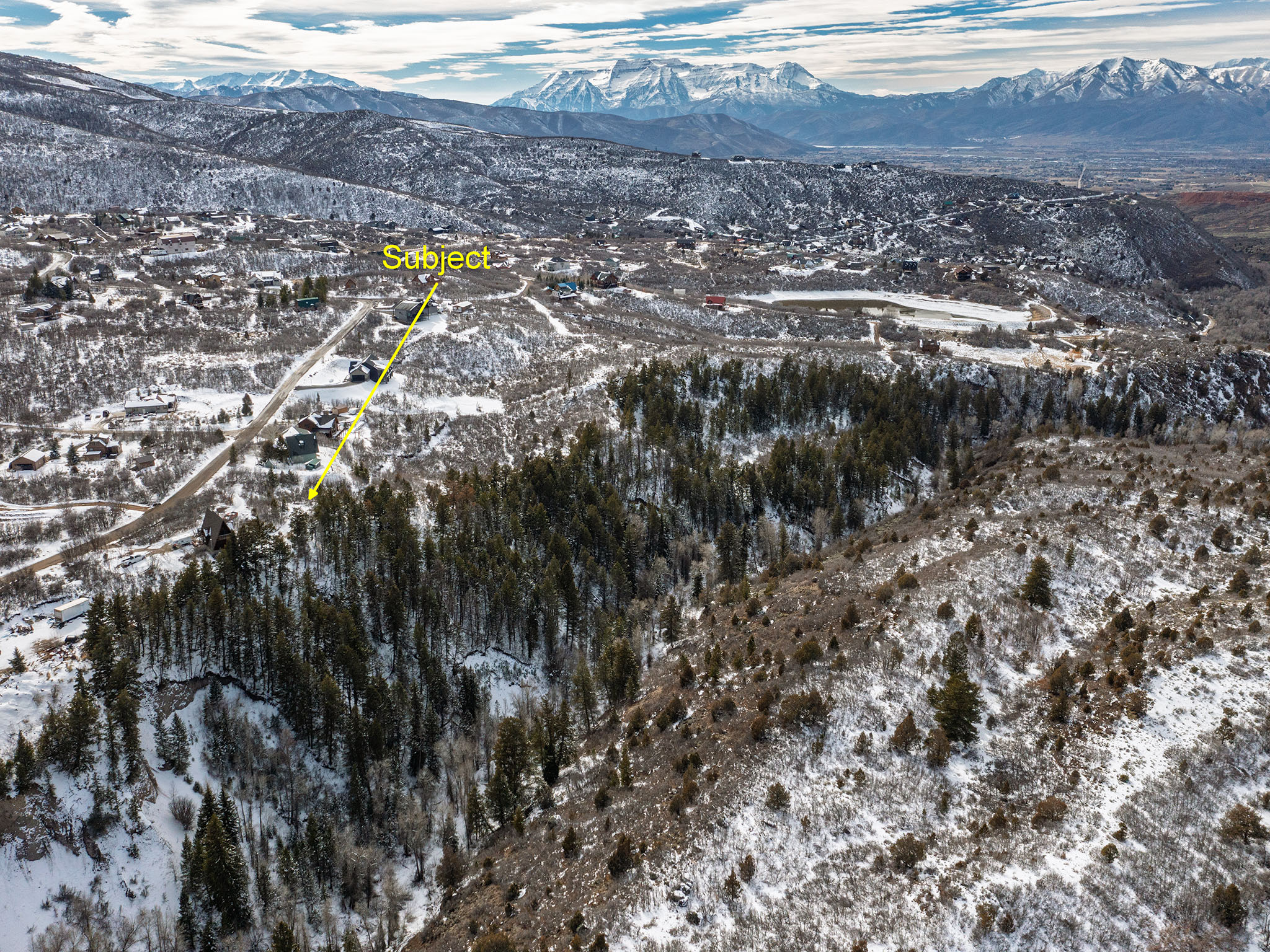 Snowy aerial view with a mountain view
