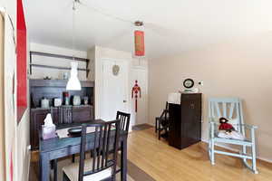 Dining area featuring light wood finished floors and baseboards