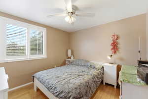 Bedroom featuring light wood-style floors and ceiling fan