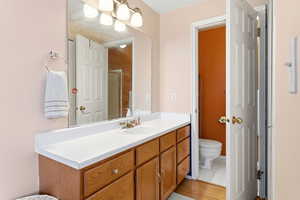 Full bath featuring vanity and a shower stall