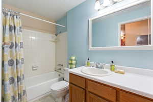 Full bathroom with vanity and shower / bath combo