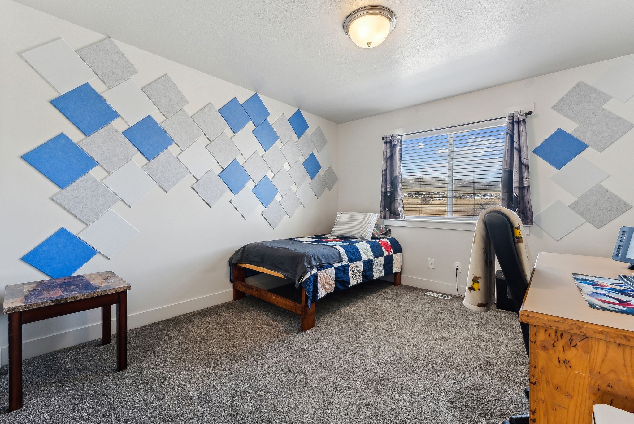 Bedroom featuring dark carpet and baseboards