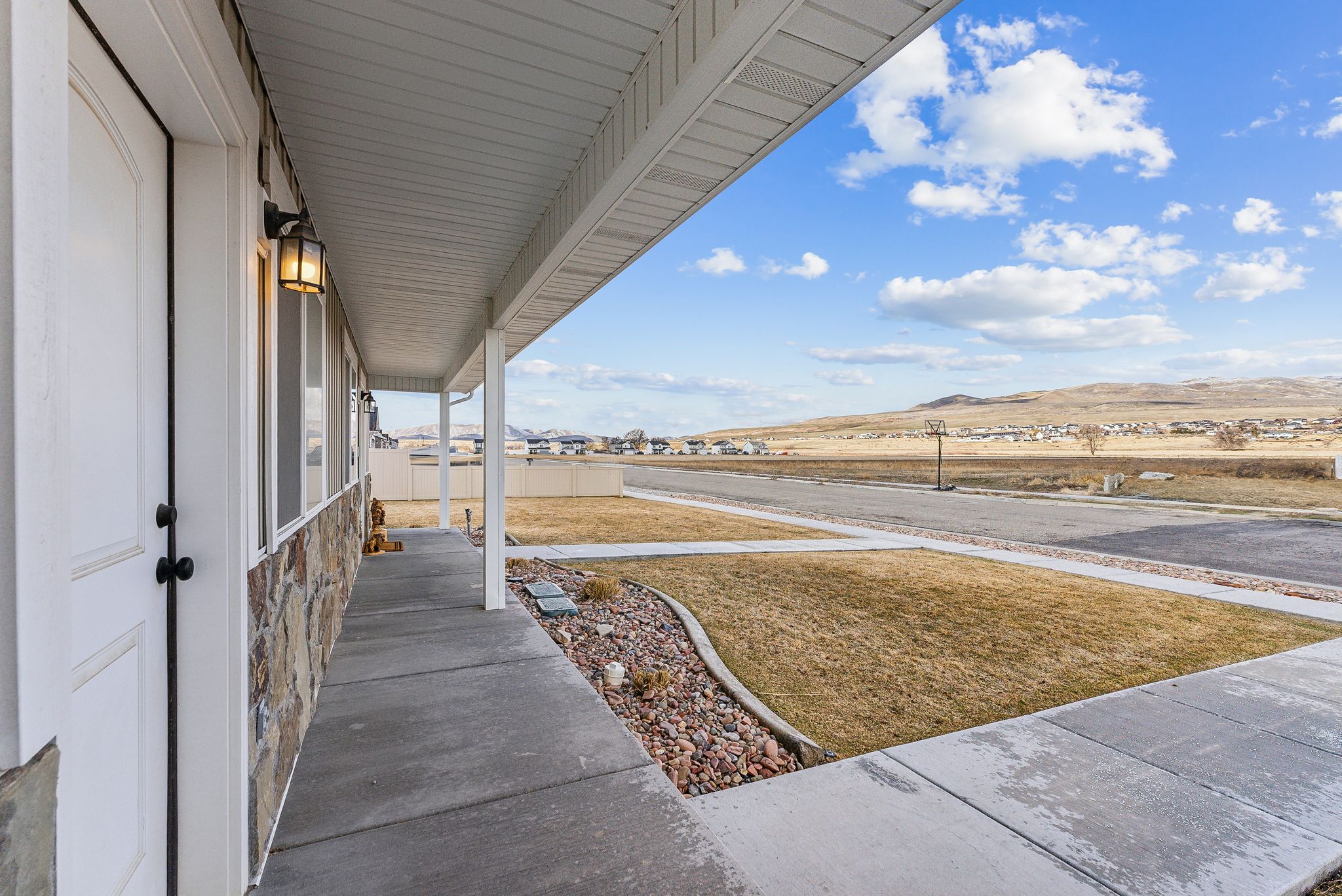 View of yard with a porch and a mountain view