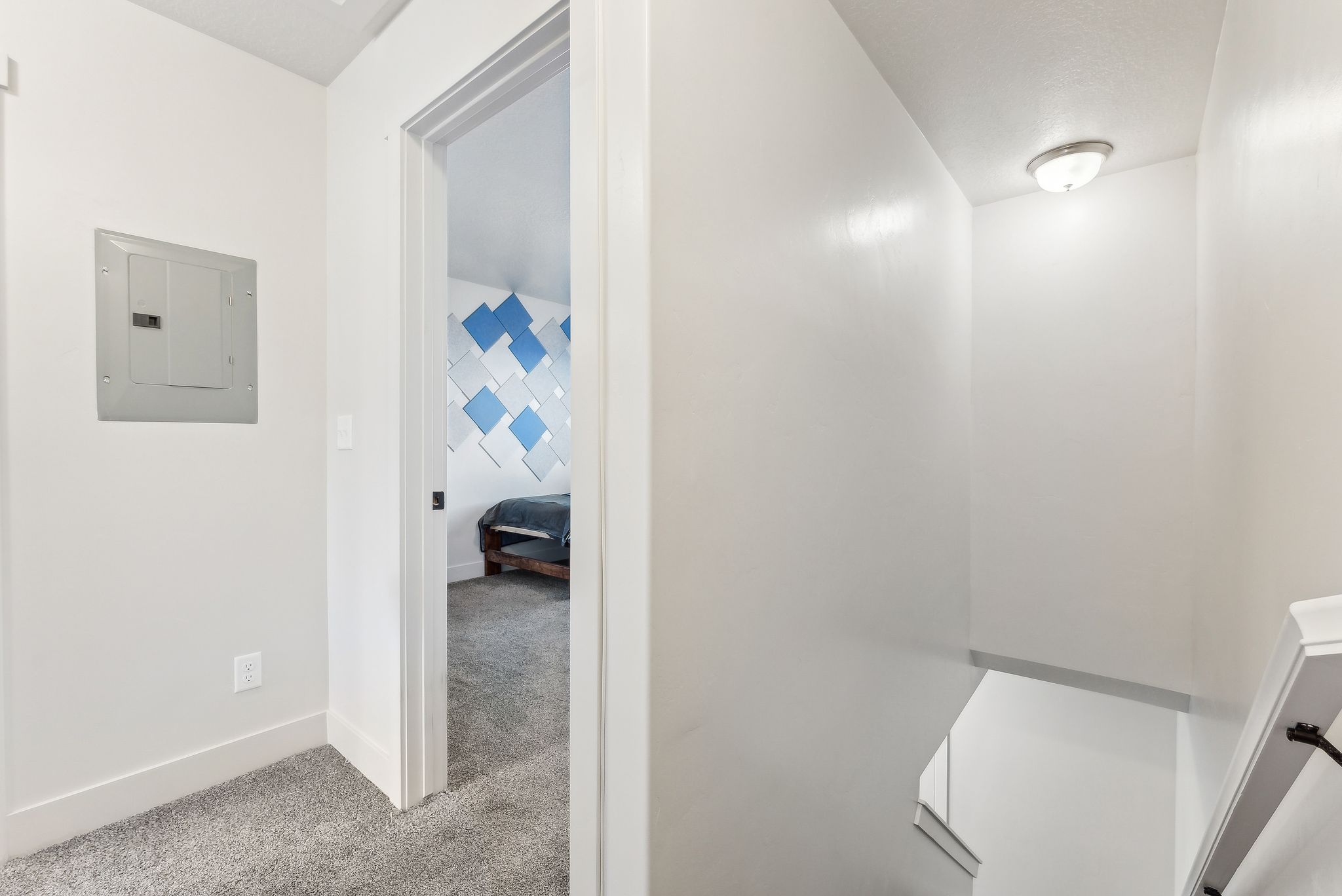 Full bathroom featuring electric panel, light carpet, and connected bathroom