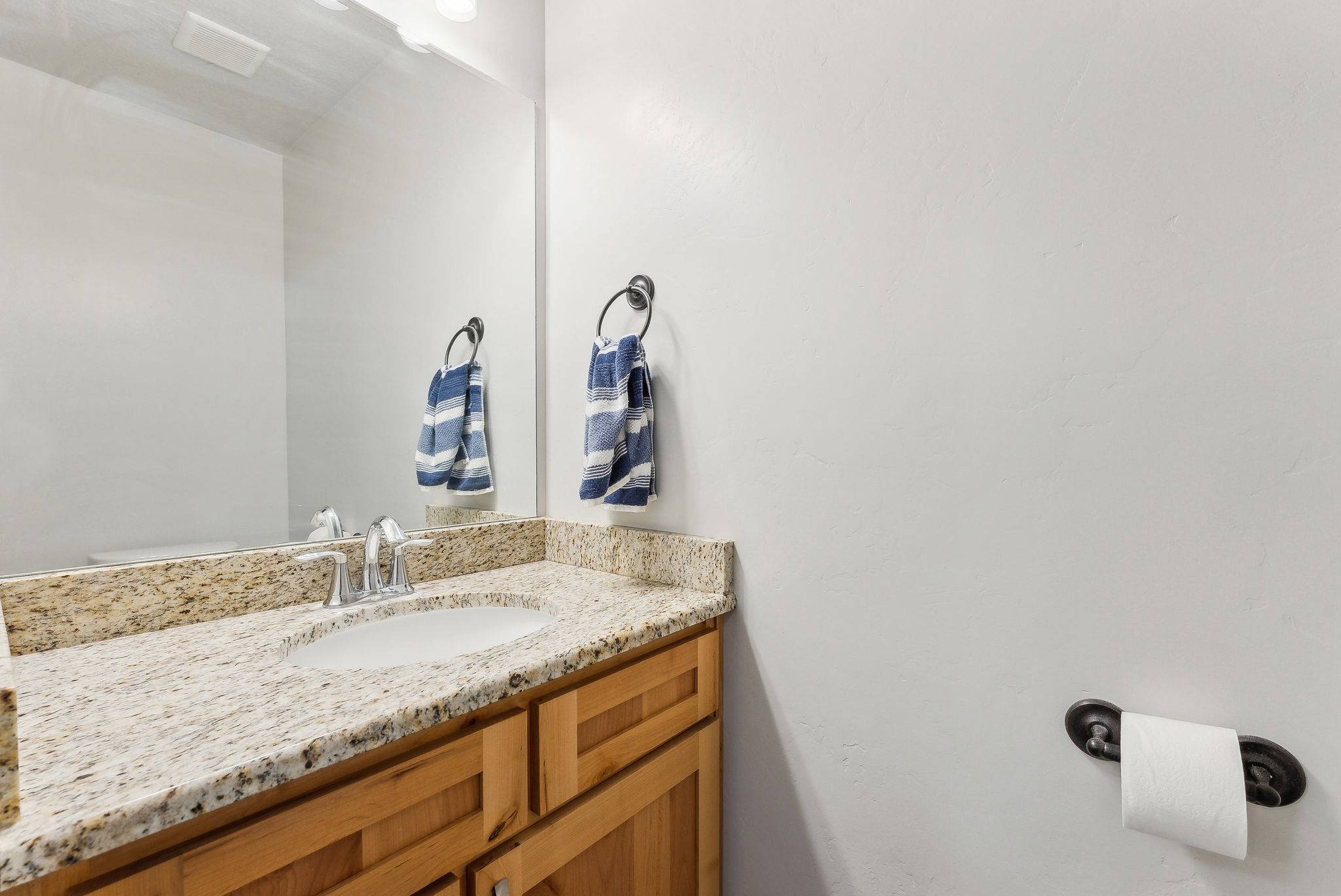 Half bathroom featuring vanity