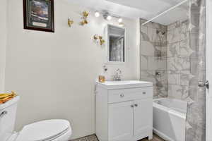 Full bath with vanity and shower / bath combo