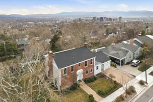 Aerial perspective of suburban area featuring a mountain backdrop
