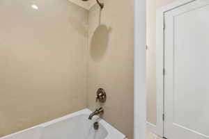 Bathroom featuring shower / washtub combination