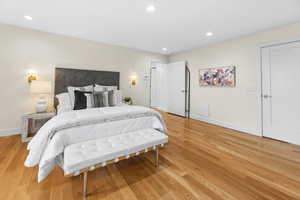 Bedroom with light wood-style flooring and recessed lighting