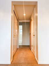 Corridor featuring baseboards