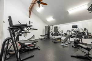 Gym with lofted ceiling and ceiling fan