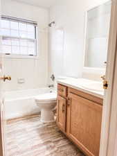 Bathroom with vanity and shower / bathtub combination