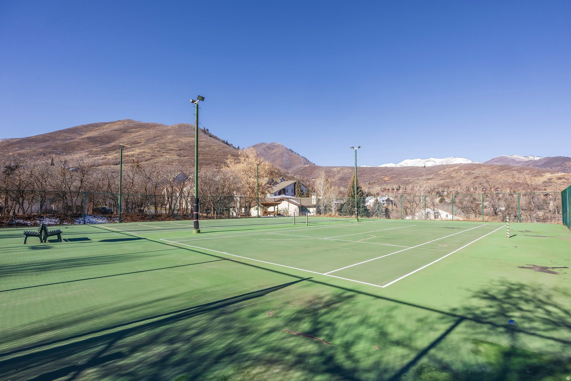View of tennis court featuring a mountain view
