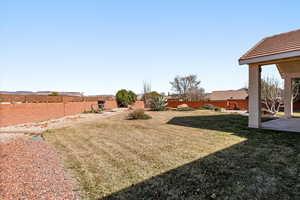 Fenced backyard with a patio area