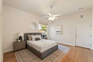 Bedroom with light wood-style flooring and a ceiling fan