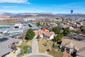 Aerial perspective of suburban area featuring a mountain backdrop