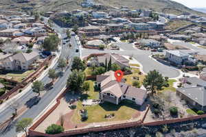 View of property location featuring nearby suburban area and a mountainous background