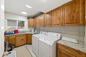 Laundry room featuring cabinet space and washing machine and dryer