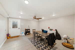 Dining area featuring baseboards and a ceiling fan