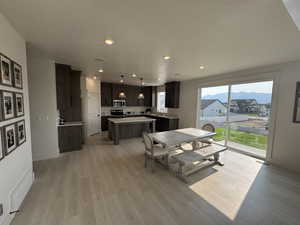 Dining room featuring recessed lighting and light wood-type flooring