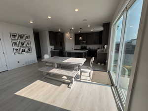 Dining room featuring light wood finished floors and recessed lighting
