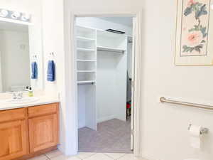 Bathroom with vanity and light tile patterned floors