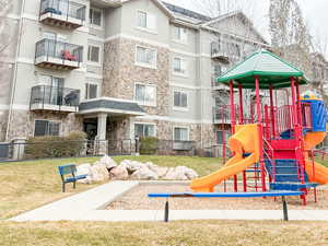 Community jungle gym with a yard