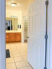Bathroom with vanity and light tile patterned floors