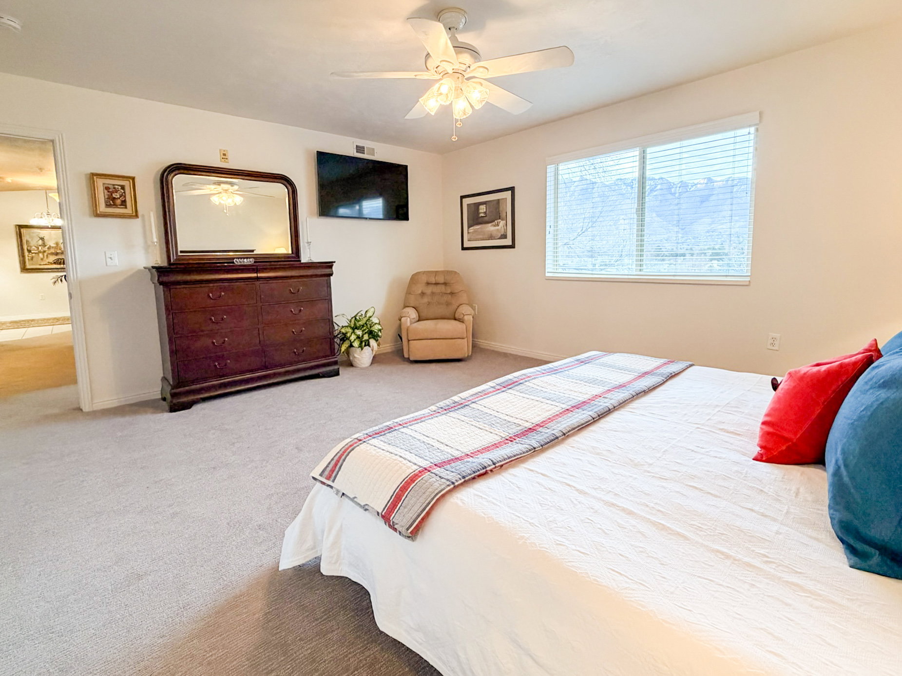 Bedroom featuring a ceiling fan and carpet floors